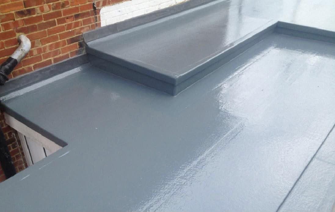 Liquid plastic flat roof coating with clean upstand detail
