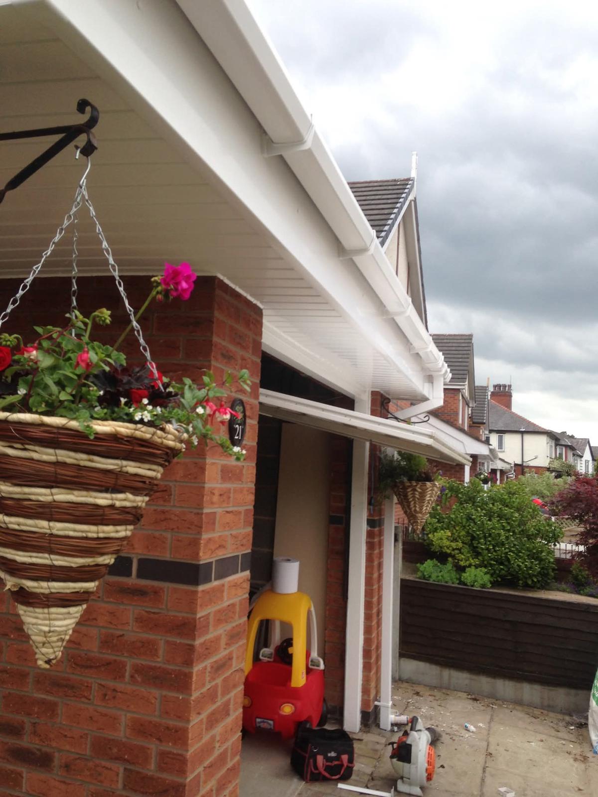 Gutter repair and roofline water flow check on a domestic property